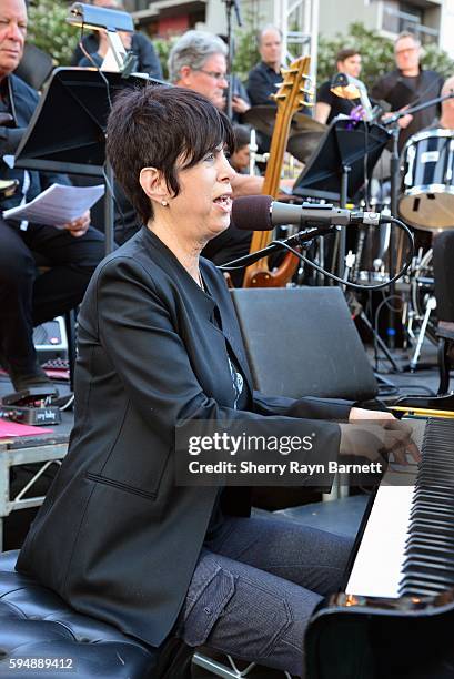 Singer and songwriter Diane Warren performs at 'Women Who Score' event at Grand Performances in Downtown LA on August 19, 2016 in Los Angeles,...