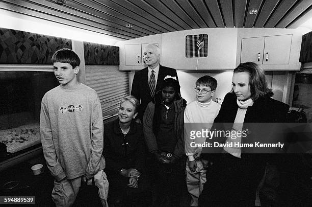 John McCain on the campaign bus with his family: son Jack, wife Cindy, daughter Bridget, son Jimmy and daughter Meghan, January 31, 2000 in Keene,...