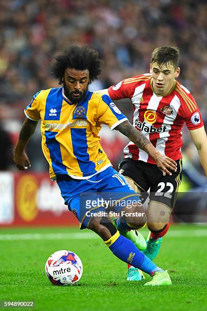Junior Brown of Shrewsbury Town is closed down by Donald Love of Sunderland during the EFL Cup second round match between Sunderland and Shrewsbury...