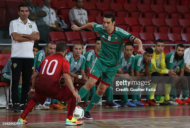 Morocco's Adil Habil with Portugal's Ricardinho in action during the Futsal International Friendly match between Portugal and Morocco at Pavilhao...