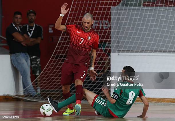 Portugal's Cardinal with Morocco's Adil Habil in action during the Futsal International Friendly match between Portugal and Morocco at Pavilhao...