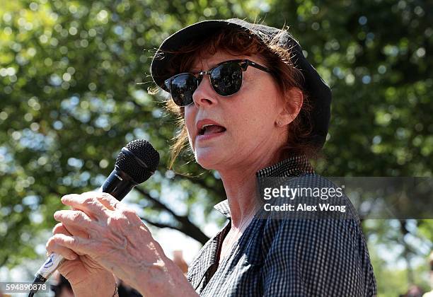 Actress Susan Sarandon speaks during a rally on Dakota Access Pipeline August 24, 2016 outside U.S. District Court in Washington, DC. Activists held...