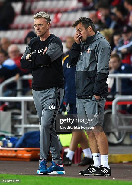 David Moyes, Manager of Sunderland looks on with Robbie Stockdale during the EFL Cup second round match between Sunderland and Shrewsbury Town at...