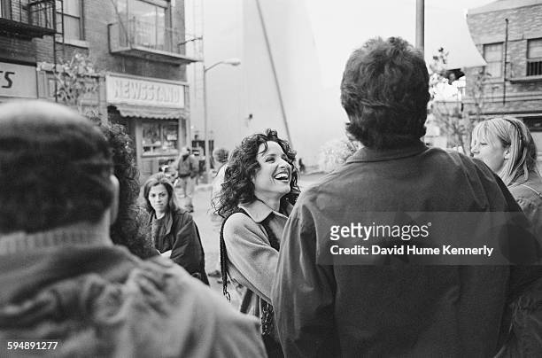 Julia Louis-Dreyfus, who plays "Elaine" on "Seinfeld," laughs with Jerry Seinfeld and members of the crew during production of the final episode of...