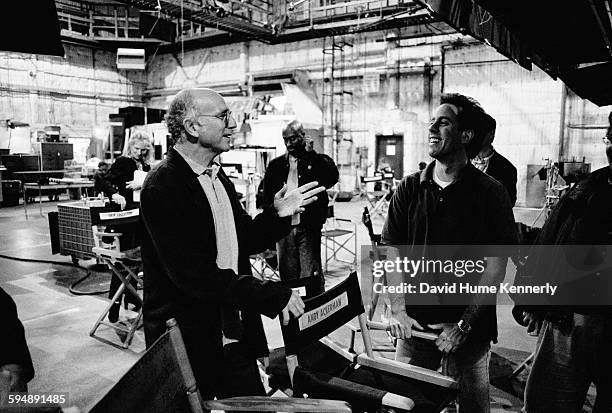 Seinfeld" co-creators Larry David and Jerry Seinfeld talk on the set in between filming the last episode of the hit television show "Seinfeld," April...