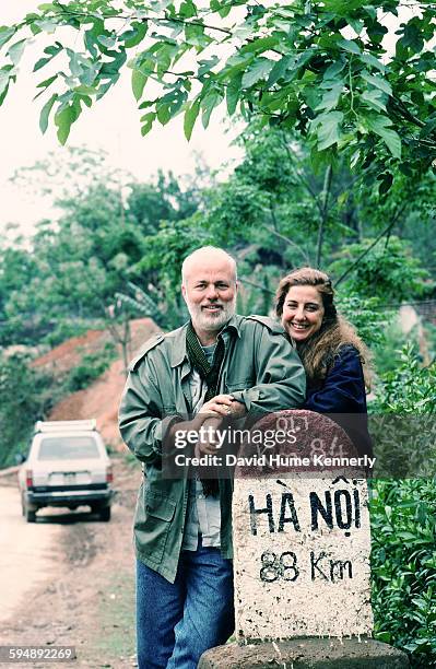 Photographer David Hume Kennerly and his wife, Rebecca Soladay, circa 1994 near Hanoi, Vietnam. Kennerly was working on his book, "Passage to...