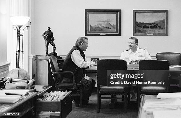 Secretary of Defense Donald Rumsfeld talks with Senior Military Assistant Admiral Edmund Giambastiani over lunch at the Pentagon, September 5, 2002...