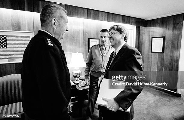 Under Secretary of Defense for Policy Douglas Feith talks to General Tommy Franks at the Pentagon, September 5, 2002 in Washington, DC.