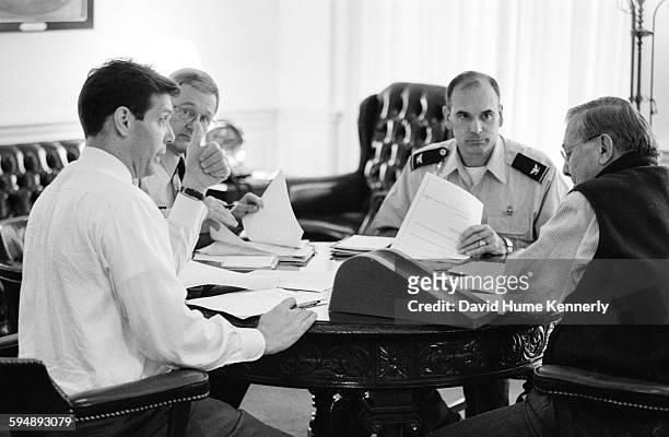 Special Assistant to the Secretary of Defense Lawrence Di Rita, Senior Military Aide Lt. Gen. John Craddock, and an unidentified military official...