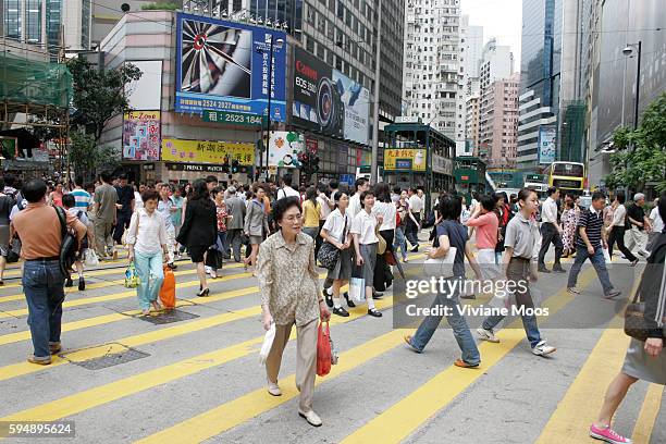 Pedestrians crossing the street in the busy section of Times Square in Causeway Bay.