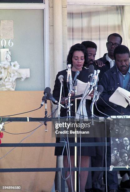 Memphis, Tennessee. Mrs. Martin Luther king Jr. Speaking from the spot where King fell when he was shot. Next to her is head of the Southern...