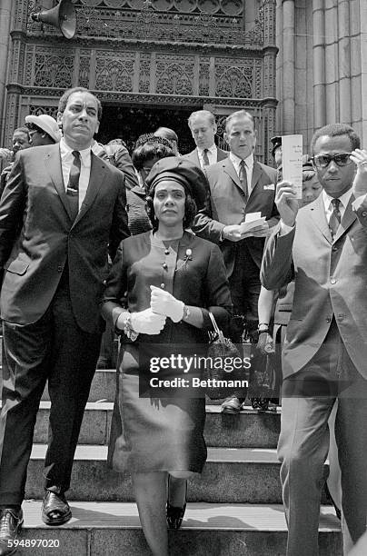 Mrs. Martin Luther King Jr., widow of the assassinated civil rights leader, leaves St. Patrick's cathedral here June 8th after a Solemn Requiem Mass...