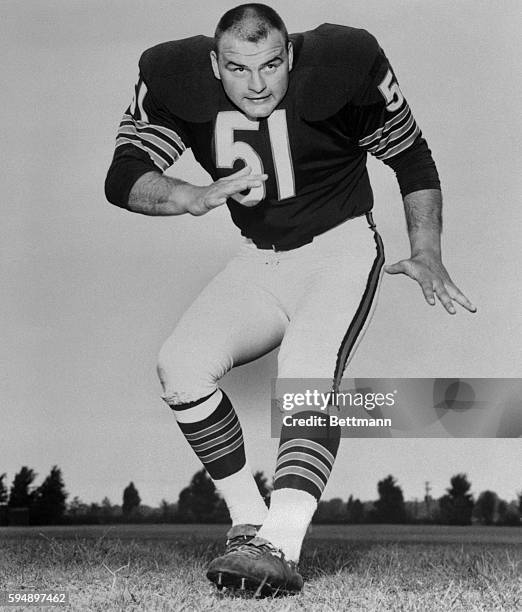 Dick Butkus in Kicking Position on Football Field