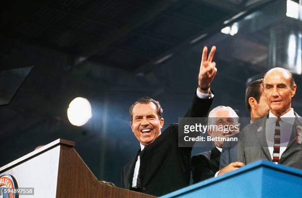 Richard Nixon waves to delegates before making his acceptance speech, 8/8, on final day of the 1968 Republican National Convention. With him on the...
