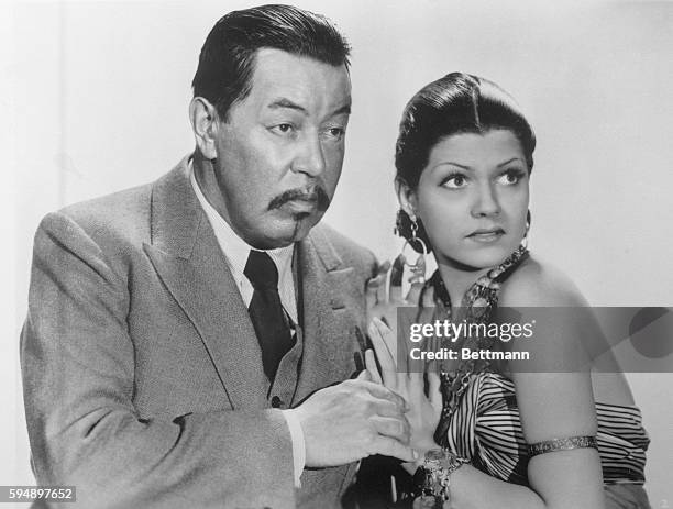 Warner Oland is with Rita Cansino, who later changed her name to Rita Hayworth, in Charlie Chan in Egypt, filmed in 1935 and now part of a...