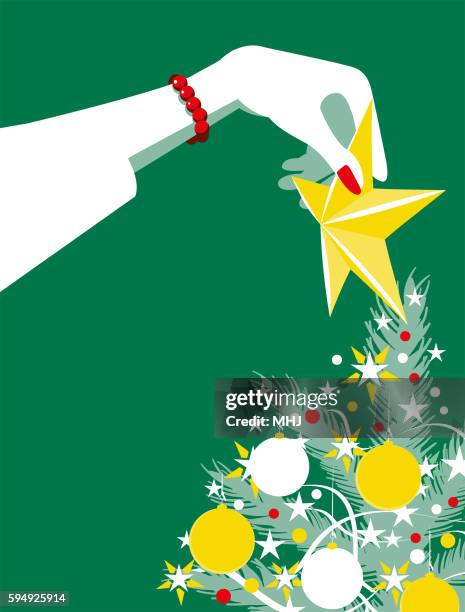 simple illustration woman putting star on christmas tree - mhj stock illustrations