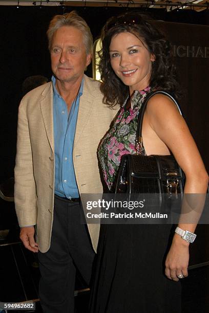 Michael Douglas and Catherine Zeta Jones attend Michael Kors Spring 2006 Collection at The Tent at Bryant Park on September 13, 2005 in New York City.