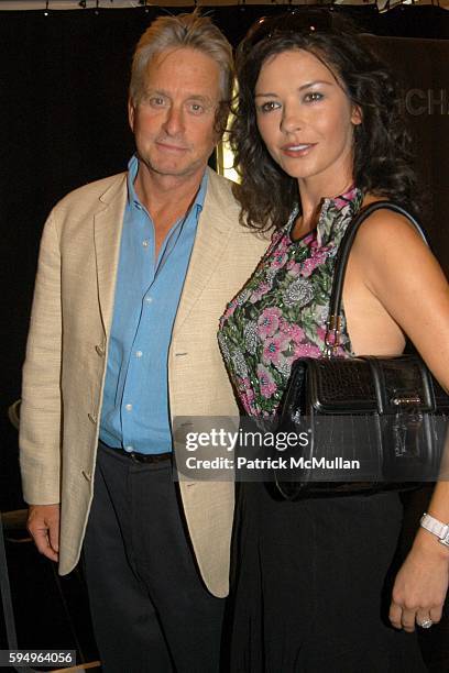 Michael Douglas and Catherine Zeta Jones attend Michael Kors Spring 2006 Collection at The Tent at Bryant Park on September 13, 2005 in New York City.