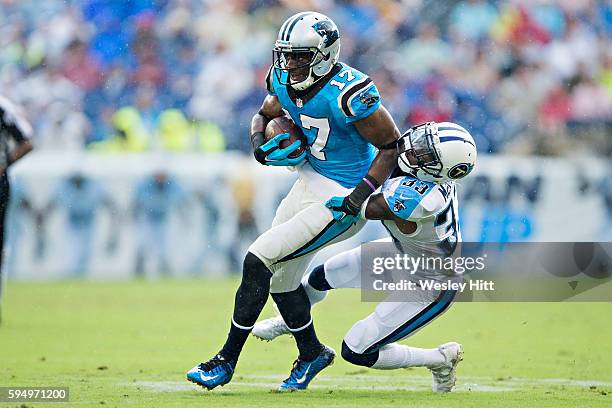 Devin Funchess of the Carolina Panthers is tacked by Brice McCain of the Tennessee Titans during a preseason game at Nissan Stadium on August 20,...