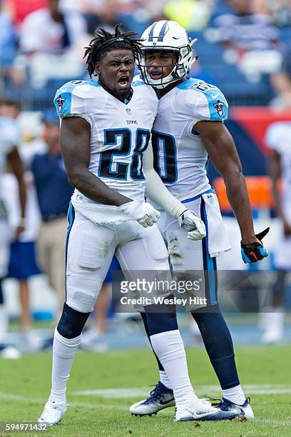 Marqueston Huff and Kevin Byard of the Tennessee Titans celebrate after breaking up a pass during a preseason game against the Carolina Panthers at...