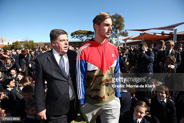 Australian Olympic gold medallist Kyle Chalmers arrives with school principal Kevin Richardson to show students his gold medal to students at...
