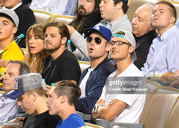 Zac Efron and Dylan Efron attend a baseball game between the San Francisco Giants and the Los Angeles Dodgers at Dodger Stadium on August 24, 2016 in...