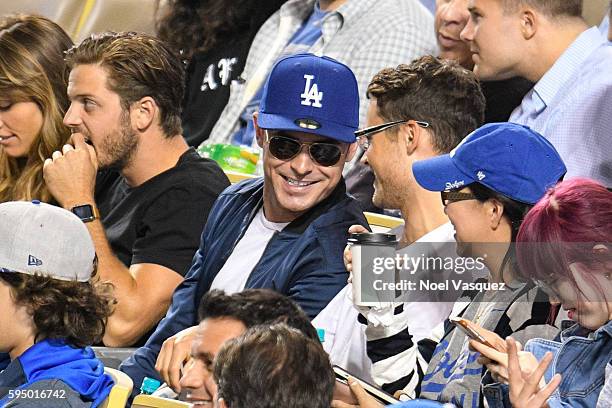 Zac Efron and Dylan Efron attend a baseball game between the San Francisco Giants and the Los Angeles Dodgers at Dodger Stadium on August 24, 2016 in...