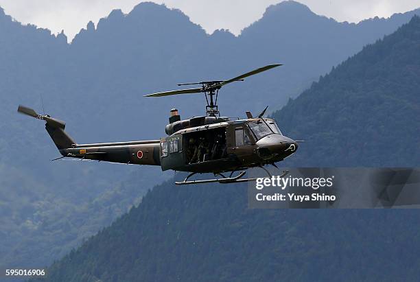 Japan Ground Self-Defence Force's UH-60 helicopter take part in the rehearsal for annual live firing exercise at the JGSDF's East Fuji Maneuver Area...