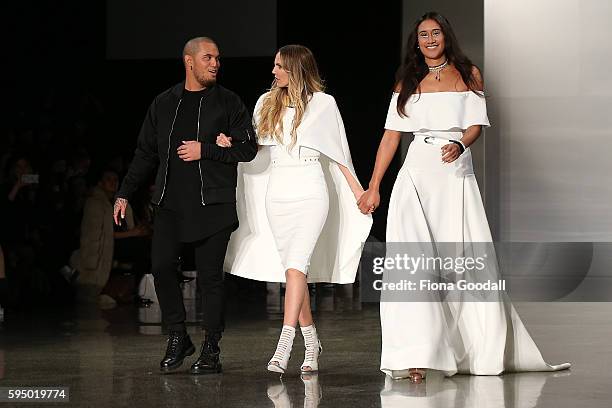 Netball Silver Fern Maria Tutaia with singer Stan Walker and designer Rochelle Goodrick showcases designs by Rochelle on the runway during 2016 New...