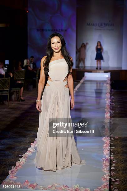 Actress Jolene Blalock models at the Make-A-Wish Greater Los Angeles Fashion Fundraiser at Taglyan Cultural Complex on August 24, 2016 in Hollywood,...