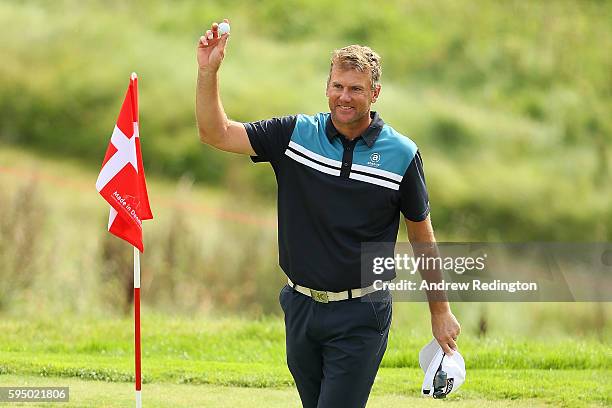 Robert Karlsson of Sweden celebrates a hole in one on the 16th hole during the first round of Made in Denmark at Himmerland Golf & Spa Resort on...