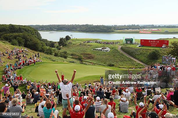 The crowd by the 16th green celebrate Robert Karlsson of Sweden's hole in one during the first round of Made in Denmark at Himmerland Golf & Spa...