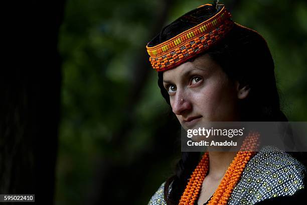 Kalash woman poses for a photo with traditional clothes at Bumburet, largest valley of Kalasha Desh in Chitral District of Khyber Pakhtunkhwa,...