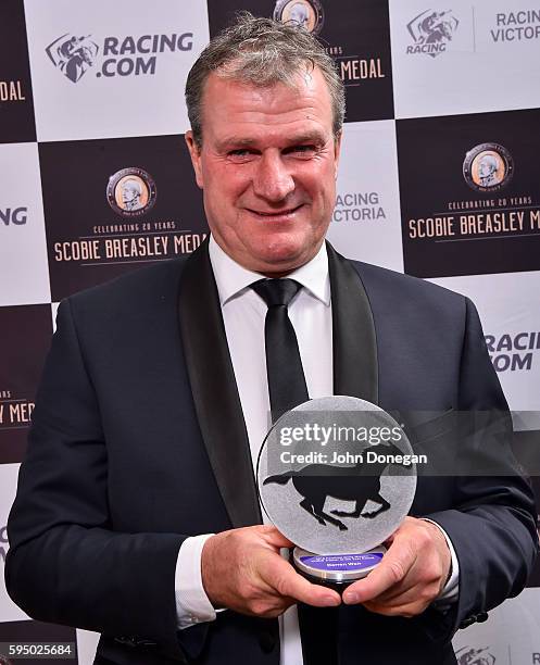 Darren Weir with the Ferntree Gully Nissan VOBIS Trainer of the Year Award at the Victorian Thoroughbred Racing Awards at Flemington Racecourse on...