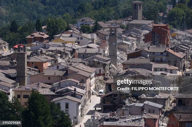 Partial view of the damaged central Italian village of Amatrice, taken on August 25 a day after a 6.2-magnitude earthquake struck the region killing...