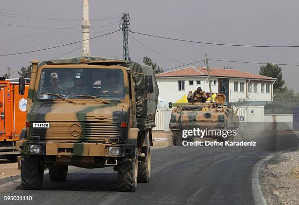 Turkish Army's armoured vehicles driving to the Syrian town of Jarabulus, as they prepare for a military operation at the Syrian border town of...