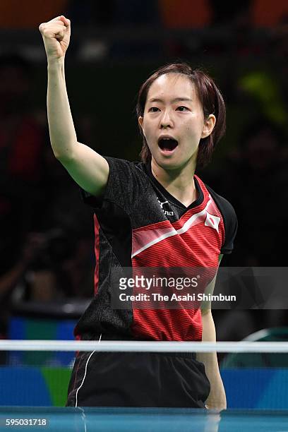 Kasumi Ishikawa of Japan celebrates a point in a match against Feng Tianwei of Singapore during the Women's Team Bronze Medal match on Day 11 of the...
