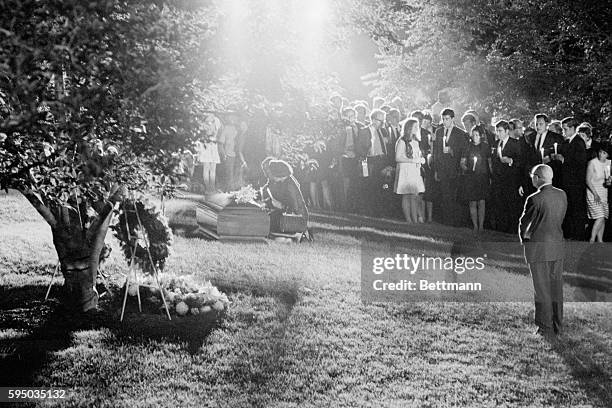 Mrs. Martin Luther King, Jr., widow of the assassinated civil rights leader, and his successor, Reverend Ralph Abernathy, kneel at the gravesite of...