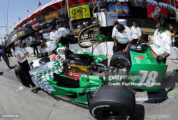 Crew members work on Simona De Silvestro's car during practice for the Indycar Series race at the 37th Toyota Grand Prix of Long Beach