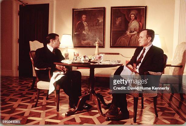Secretary of Defense Caspar Weinberger dines with Vice President George H.W. Bush in the Old Executive Office Building circa 1983 in Washington, DC. .