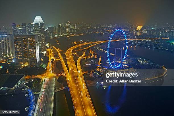 elevated view of singapore flyer at night - singapore flyer - fotografias e filmes do acervo