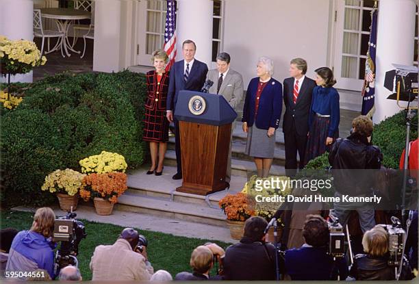 First Lady Nancy Reagan, President-Elect George H.W. Bush, President Ronald Reagan, Mrs. Barbara Bush, Vice President-Elect Dan Quayle, and Mrs....