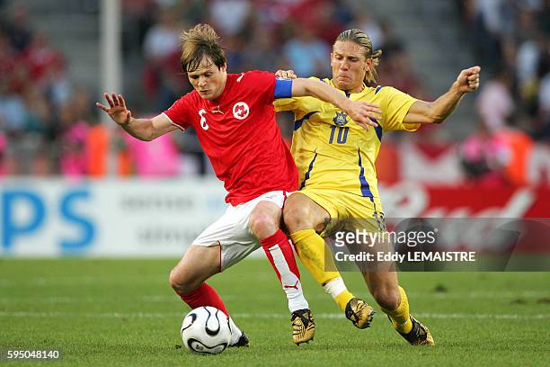 Johann Vogel and Andriy Voronin during the 2nd round match of the 2006 FIFA World Cup between Switzerland and Ukraine in Cologne.