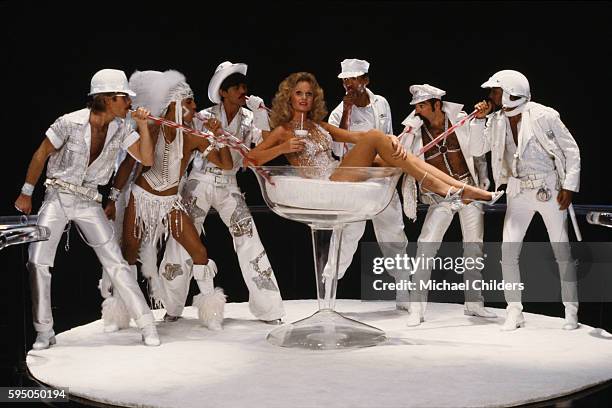 American actress Valerie Perrine surrounded by members of the American disco band Village People: David Hodo, Felipe Rose, Randy Jones, Alex Briley,...