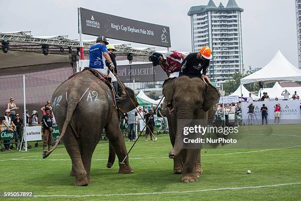 Elephant polo team battle for the ball during a match at the 2016 King's Cup Elephant Polo at Anantara Chaopraya Resort in Bangkok, Thailand on March...