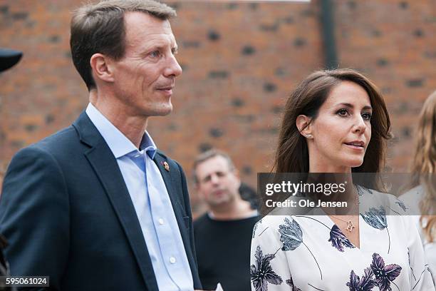 Princess Marie and husband Prince Joachim talks to people at the third world charity organisation, Care, during the royal couples visit at the Top...