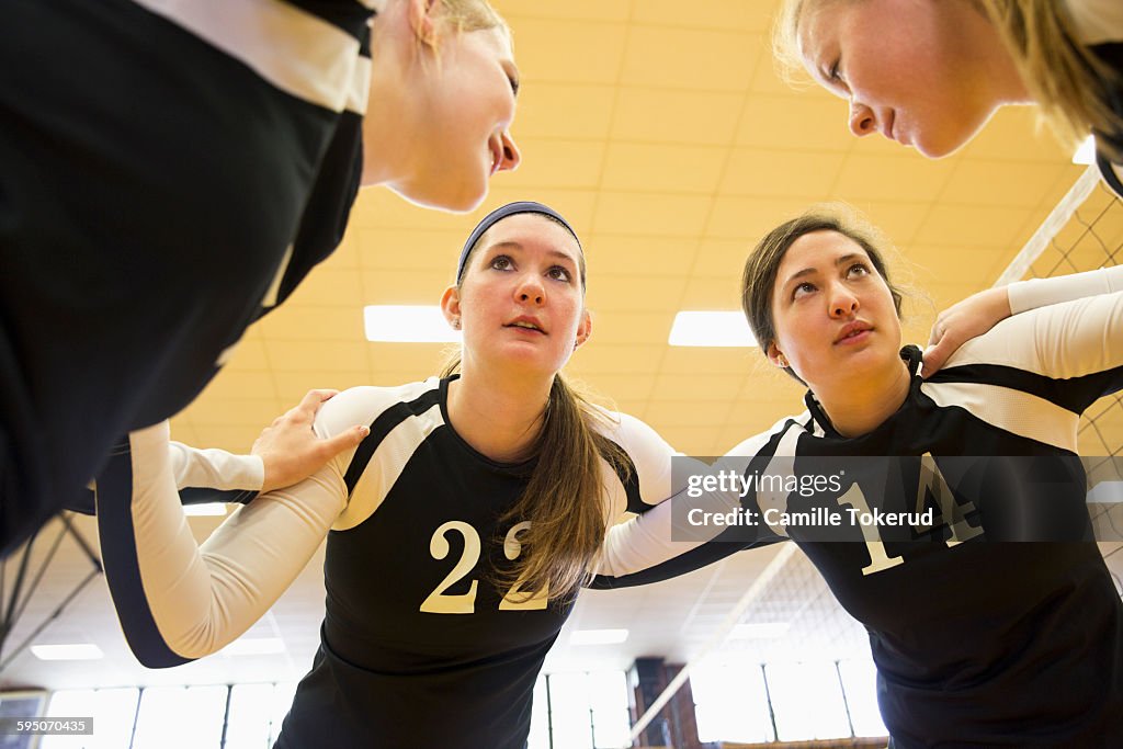 Female Volleyball teammates talking