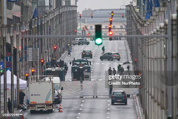 Security perimeter fence stands on Wetstraat, in Brussels, Belgium, on March 23, 2016. Police continue investigations after yesterday's explosions at...