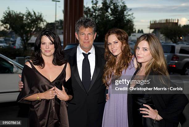 Allison Jones, David Foster, Erin Foster, and Jordan Foster on the red carpet before a charity fund raising gala for the David Foster Foundation in...