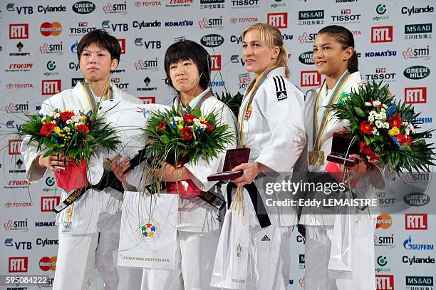 Tomoko Fukumi of Japan with the silver medal, Haruna Asami of Japan with the gold medal, Charline Van Snick of Belgium and Sarah Menezes of Brazil...